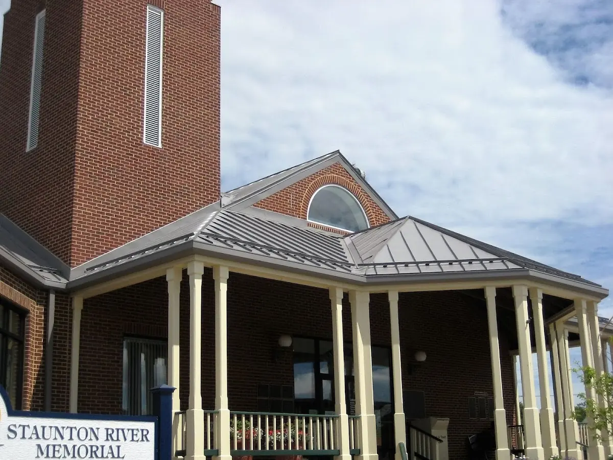 Skilled roofing craftsmen working on a residential roof in Watertown